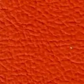 Orange textured surface with undulating ridges, featuring a lighter white area at the upper right, displaying a consistent repeating pattern.